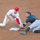 Marlins’ Miguel Rojas gets up close and personal with Phillies’ Scott Kingery during the teams’ 3-game series in Philly. Eleven Marlins have now tested positive for COVID-19.